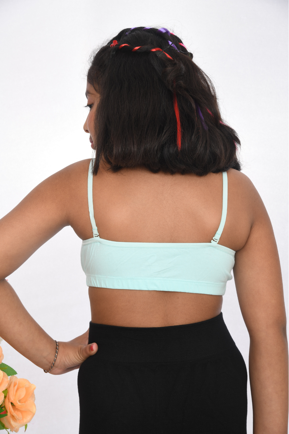 School wearing, sea green training bra with lace detailing, back view, adjustable straps.